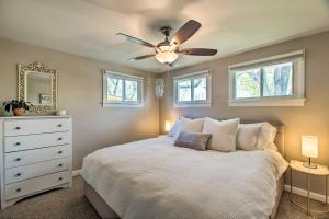a bedroom with a bed with a ceiling fan at Patio, Grill and Yard Cozy Denver Abode! in Denver