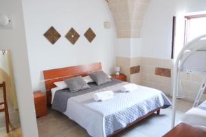 Postel nebo postele na pokoji v ubytování Largo Imperiali B&B + 27 fotografií