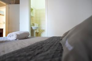 Postel nebo postele na pokoji v ubytování Largo Imperiali B&B