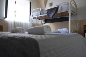 Postel nebo postele na pokoji v ubytování Largo Imperiali B&B