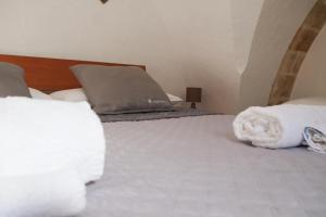 Postel nebo postele na pokoji v ubytování Largo Imperiali B&B