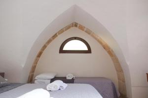 Postel nebo postele na pokoji v ubytování Largo Imperiali B&B