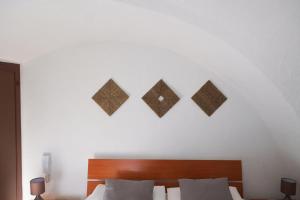 Postel nebo postele na pokoji v ubytování Largo Imperiali B&B