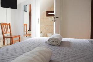 Postel nebo postele na pokoji v ubytování Largo Imperiali B&B
