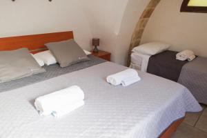 Postel nebo postele na pokoji v ubytování Largo Imperiali B&B