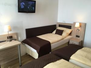 Postel nebo postele na pokoji v ubytování EA Hotel Lipno