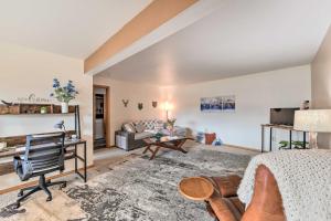 a living room with a bed and a couch at Juneau Apartment - Walk to Hiking and Breweries in Mendenhaven