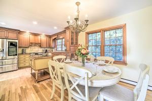 a kitchen with a dining room table and chairs at Family-Friendly Retreat with Hot Tub 1 Mi to Dtwn in Saratoga Springs