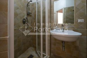Kúpeľňa v ubytovaní 15 FARO - Confortevole bilocale sulla spiaggia di Porto Faro