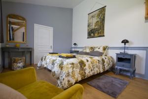 En eller flere senger på et rom på Gîte Aux Tuileries
