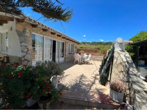 a view of a house with a garden at ORBETA in Teulada