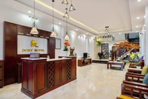 a lobby of adqerg with a reception desk and a lobby at 1 Stop Dory Hotel in Hoi An