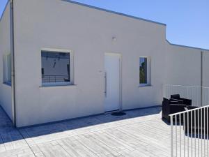 a white building with a door and a window at Villa Caravaggio Comfort e Relax in Rocca San Giovanni
