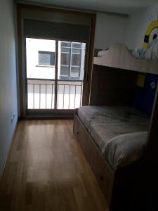 A bed or beds in a room at boiro playa barraña