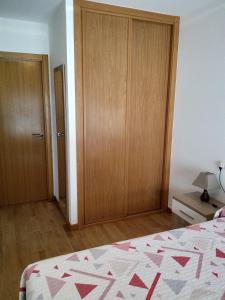 A bed or beds in a room at boiro playa barraña
