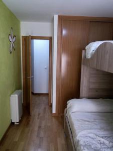 A bed or beds in a room at boiro playa barraña