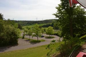 an aerial view of a parking lot with windmills at Huis 38 Seepark Kirchheim in Kirchheim +32 photos