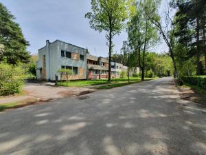 an empty road in front of a building at Before reconstruction chance in Jūrmala