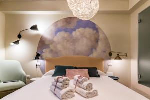 A bed or beds in a room at Cielo e Nuvole