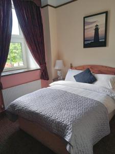 Letto o letti in una camera di Buggle's Pub and Accommodation