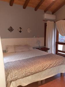 Ένα ή περισσότερα κρεβάτια σε δωμάτιο στο Guesthouse El Tata
