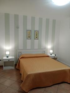 En eller flere senge i et værelse på Appartamentino Cinisi