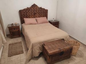 a bedroom with a large bed and two night stands at Casa Mango amplia con alberca y cerca de la Media Luna !!! in Río Verde +37 photos