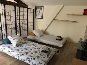 a room with a bed and a couch in it at La Pignotte in Avignon