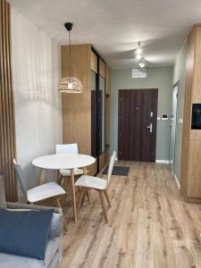 Posezení v ubytování Ukiel Park Green Apartament