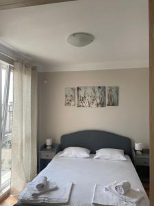 En eller flere senge i et værelse på Marea Garden apartments + 20 billeder