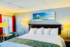 a hotel room with a bed and a view of a pier at Wells Moody Motel in Wells