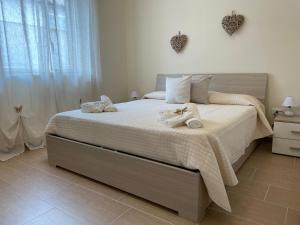 Postel nebo postele na pokoji v ubytování Maison Giulia