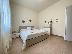Postel nebo postele na pokoji v ubytování Maison Giulia