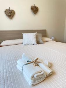 Postel nebo postele na pokoji v ubytování Maison Giulia