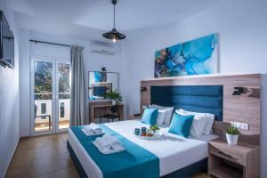 Postel nebo postele na pokoji v ubytování Floral Hotel