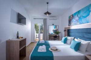 Postel nebo postele na pokoji v ubytování Floral Hotel