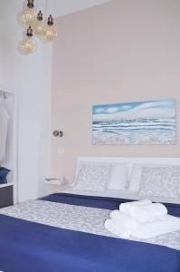 Postel nebo postele na pokoji v ubytování Luna Chiara Home