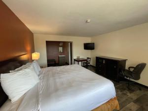Voodi või voodid majutusasutuse Tourist Inn toas