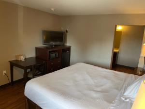 Katil atau katil-katil dalam bilik di Tourist Inn
