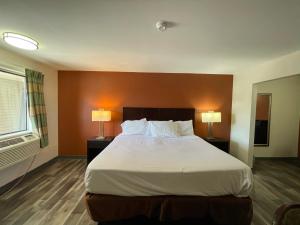 Voodi või voodid majutusasutuse Tourist Inn toas