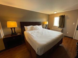 Voodi või voodid majutusasutuse Tourist Inn toas