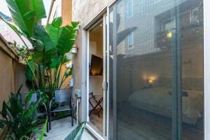 a sliding glass door leading to a bedroom with a bed at The San Diego Studio - Free Parking in San Diego