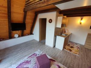 an empty room with a kitchen and a living room at Villa Dream House Bihac in Bihać