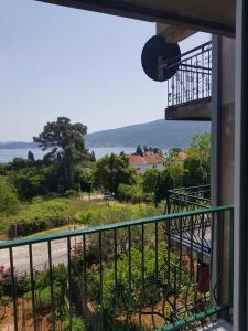 a balcony with a view of a body of water at Family apartment Krivokapic in Baošići