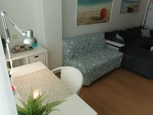 a living room with a couch and a chair at Silver A 27 in Byala