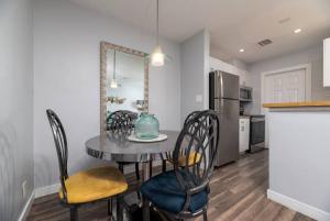 a kitchen and dining room with a table and chairs at The Palms at Middle River Terrace 3 in Fort Lauderdale