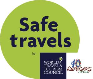 a sign for a safe travels event with the words world tourism council at 40 Amigos Hotel in Jardin
