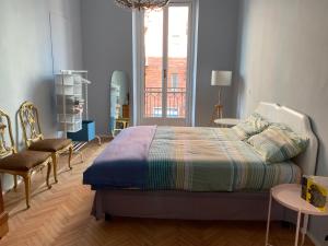 Un pat sau paturi într-o cameră la casa liberty Di&Pi