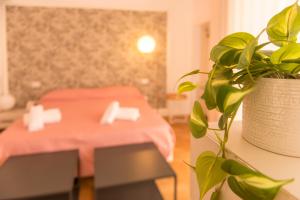 a plant sitting on a table in a room at Le Dimore di Puglia - Palazzo Ladogana in Monopoli