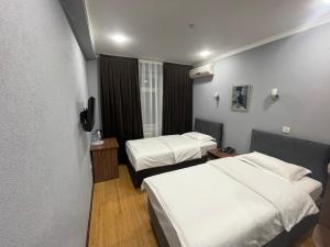 Katil atau katil-katil dalam bilik di Grand Avenue Hotel
